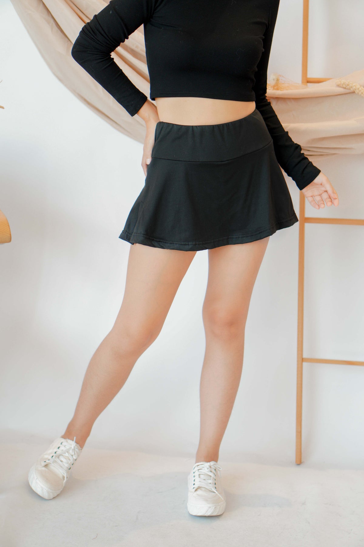 Drop Shot Mini Skirt in Black