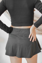 Drop Shot Mini Skirt in Black