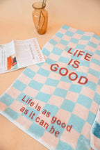 Life Is Good Checkered Rug in Teal Blue