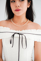 Olyssia Off Shoulder Top in White with Black Ribbon
