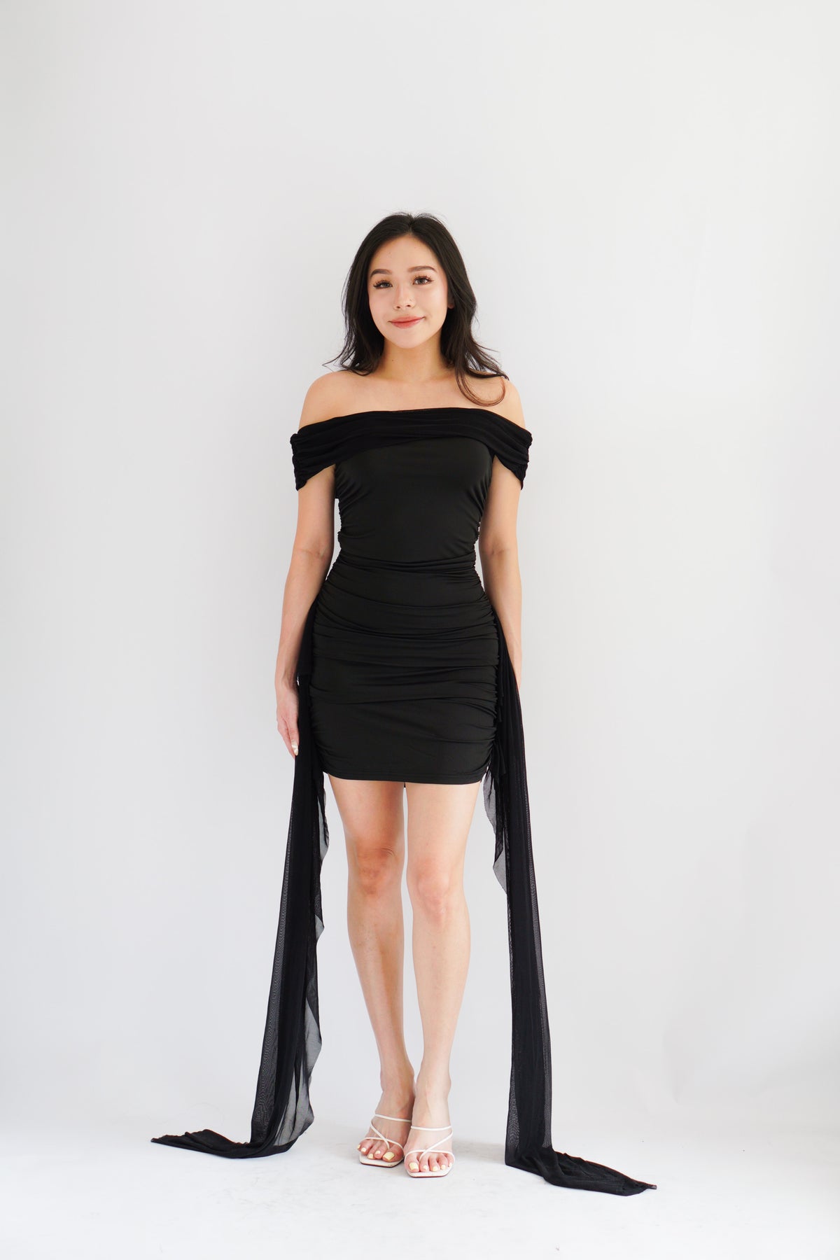 Izabel Off Shoulder Mini Bodycon Dress with Long Sash in Black