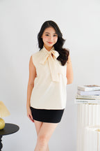 Rinda Sleeveless Bow Tie Top in Beige