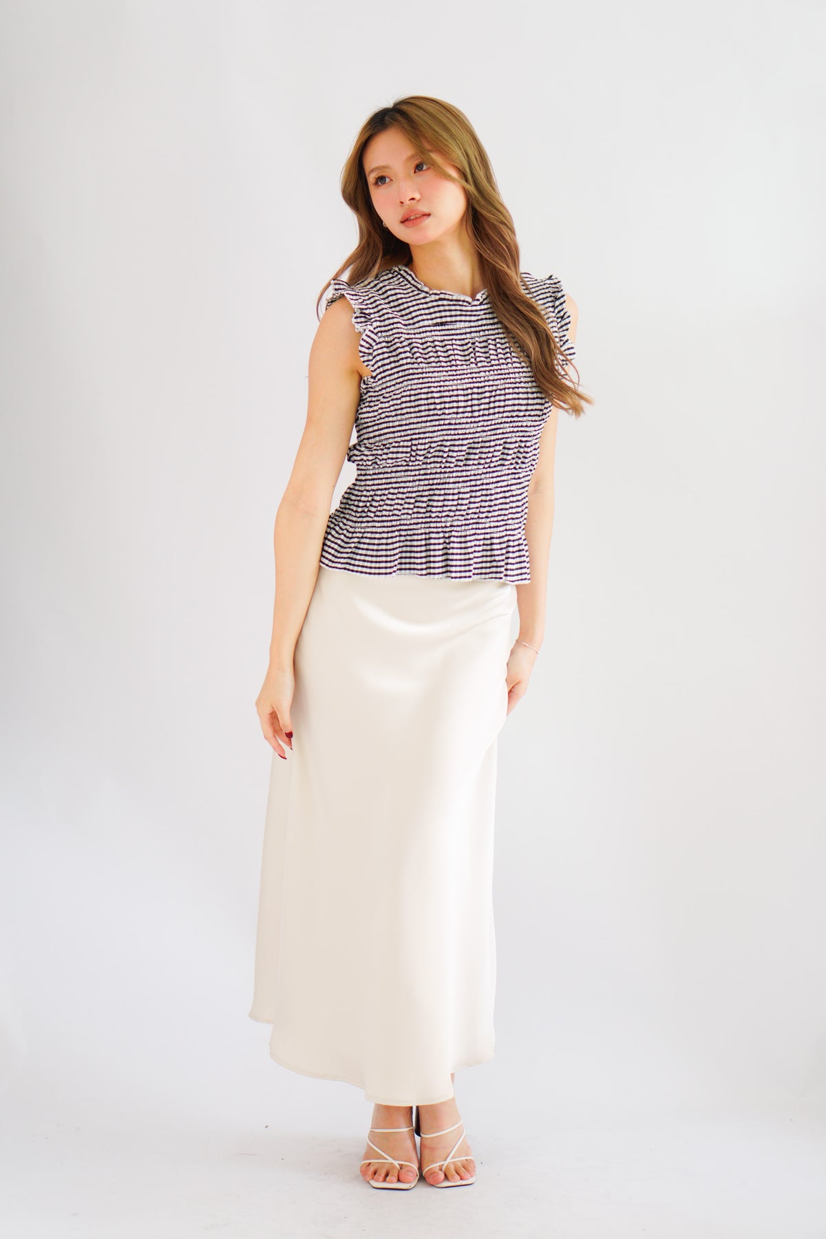Carcy Gingham Smocked Top in Black