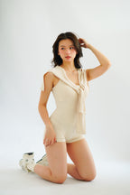 Lovi Padded Jumpsuit with Self Tied Scarf in Beige