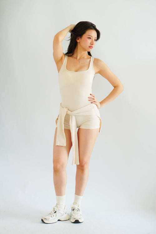 Lovi Padded Jumpsuit with Self Tied Scarf in Beige