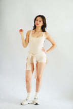 Lovi Padded Jumpsuit with Self Tied Scarf in Beige